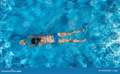 Aerial Top View Of Woman In Swimming Pool Water From Above Tropical