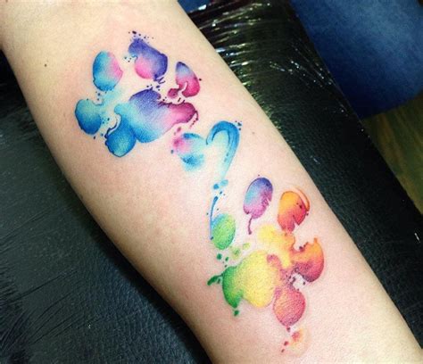 Maybe you would like to learn more about one of these? Photo - Dog Paw Prints tattoo by Claudia Denti in 2020 ...