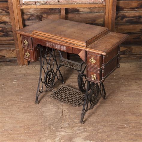 antique singer sewing machine and oak cabinet ebth