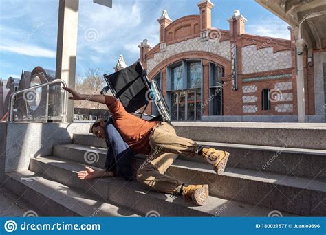Disabled Young Man In A Wheelchair Falls Down Some Stairs Stock Image
