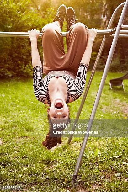 Girl Hanging Upside Down Photos Et Images De Collection Getty Images