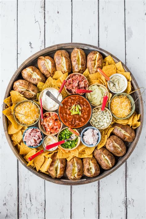 Many people might know charcuterie boards as meat and cheese boards, but they are so much more than that. EPIC Baked Potato Dinner Board - Reluctant Entertainer