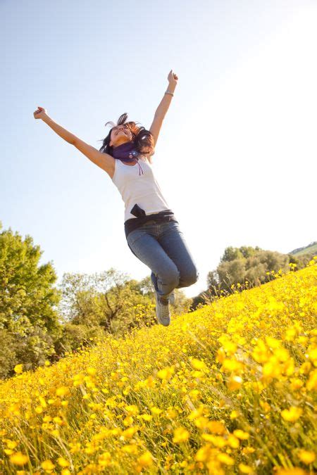 Cheerful Woman Jumping Full Of Joy Freestock Photos