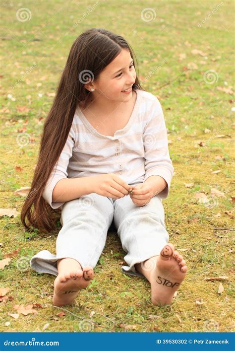 Girl With Smileys On Toes And Sign Stop On Soles Stock Photo Image Of