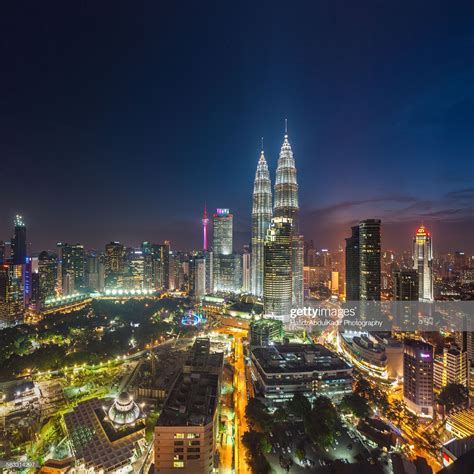An Aerial View Of The City Lights And Skyscrapers At Night In Malaysia