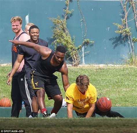 patrick schwarzenegger takes a tumble during basketball game with friends in santa monica