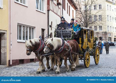 The Horse Carriage With Tourists Rides Along The Streets In Nuremberg