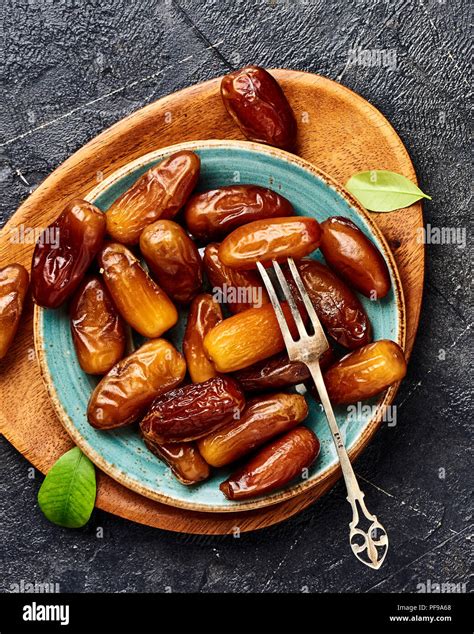Dried Dates Fruits On Plate Top View Of Pitted Dates Stock Photo Alamy