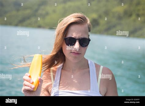Sunscreen Woman Applying Suntan Lotion Showing Bottle Beautiful Smiling Happy Caucasian Woman