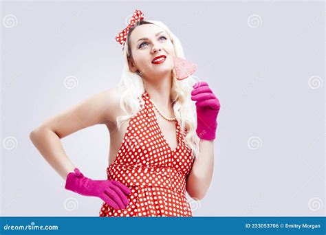 Pin Up Concepts And Ideas Portrait Of Cute Charming Blond Girl In Pin Up Style Posing With Red
