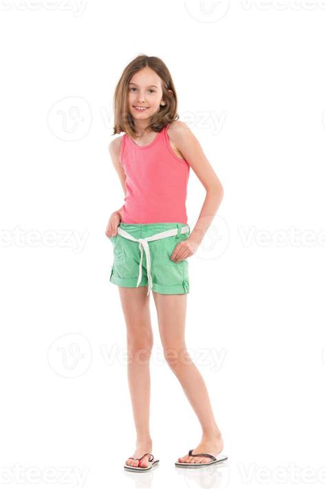 Cheerful Girl Holding Hands In Pockets 944670 Stock Photo At Vecteezy