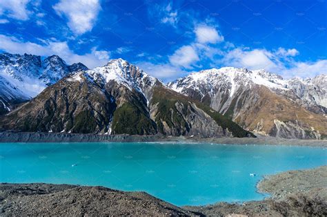 Glacier Lake With Turquoise Blue Water And Mountains Landscape High