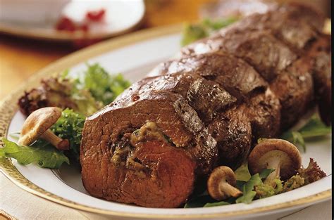 Season with salt and pepper, gently pressing to adhere. Gorgonzola- and Mushroom-Stuffed Beef Tenderloin with ...