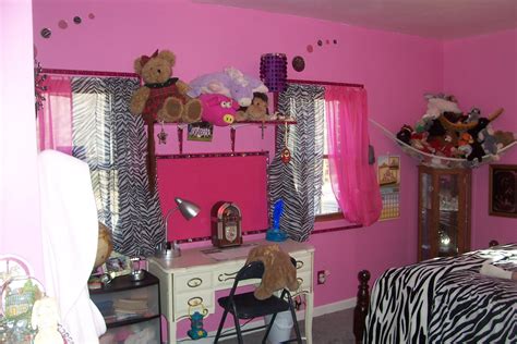 a bedroom with pink walls and zebra print curtains