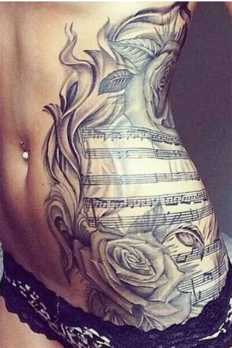 The roses add a special outlook to the design. Music And Rose Tattoo #tattooideaslive #music #rose #side ...