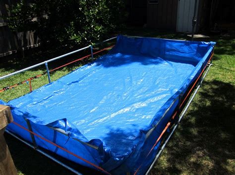 The windmill spins and the teletubbies go to watch amy, cameron and alice playing in their paddling pool. Giant DIY Paddling Pool in Backyard - The Dirt Effect ...