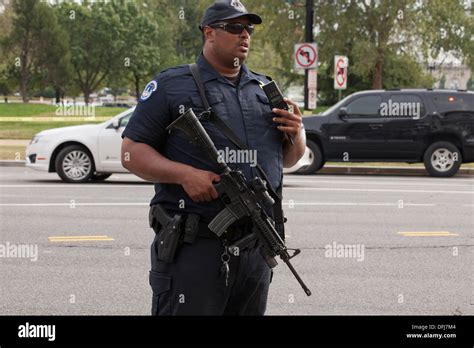 Policeman Carrying A Semi Auto Rifle At A Crime Scene Washington Dc
