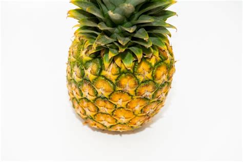 Single Pineapple With Green Leaves Isolated On A White Background