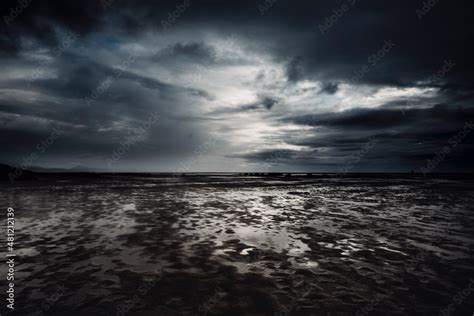 Dramatic Cloudscape And Flood Beach In Dark Night Weather Stormy And