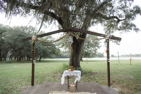 Simple Rustic Wedding Arch With Small Chandelier