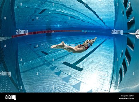 A Female Swimmer Training In An Open Air Olympic Pool France