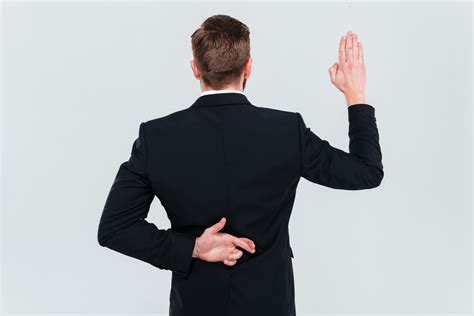 Back View Of Business Man In Black Suit Lying Holding Hand With