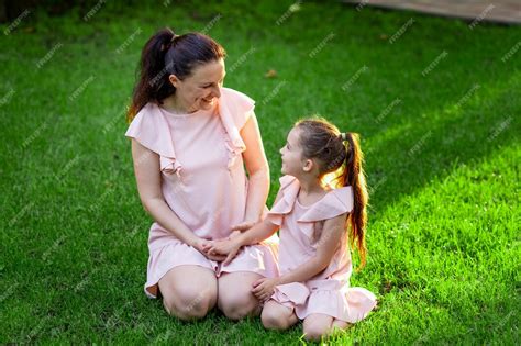 Premium Photo Mother And Daughter 5 6 Years Old Walking In The Park In The Summer Mother