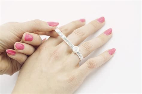 Wrap the paper (or string) around your finger, for which you are measuring the ring.the paper should be exactly where you put on your ring. 5 Ways How to Figure out Ring Size Without Her Knowing
