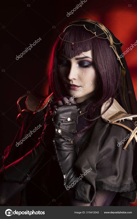 A Beautiful Busty Cosplay Girl Wearing An Erotic Leather Costume Stock