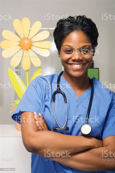 Close Up Of African Female Nurse In Hospital Stock Photo Download