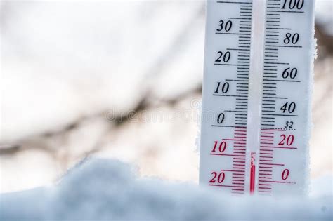 The Thermometer Lies On The Snow In Winter Showing A Negative