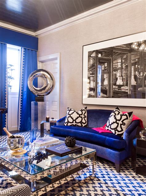Tufted royal blue sofa inside a neutral colored living room; Décor 101: How to Mix and Match Patterns the Right Way ...