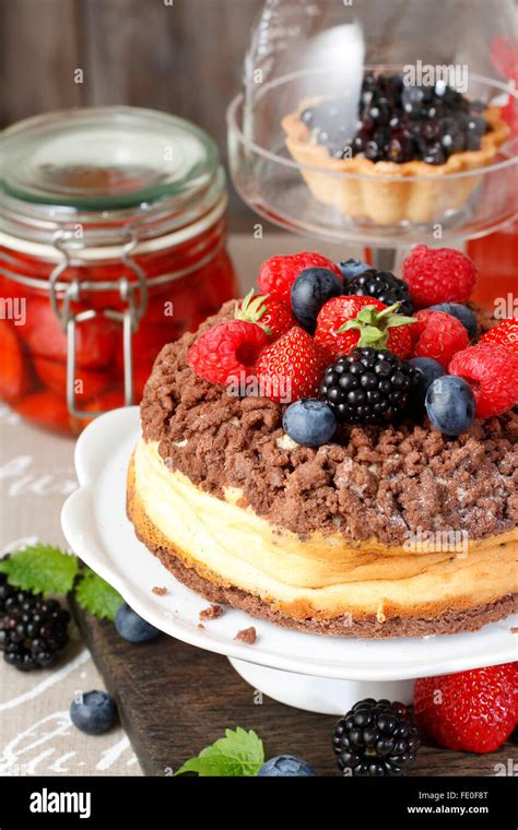 Cheesecake With Chocolate Topping Decorated With Summer Fruits