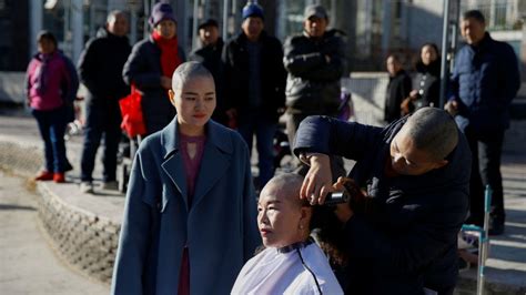 Four Chinese Activists Shave Heads To Protest Persecution Of Husbands