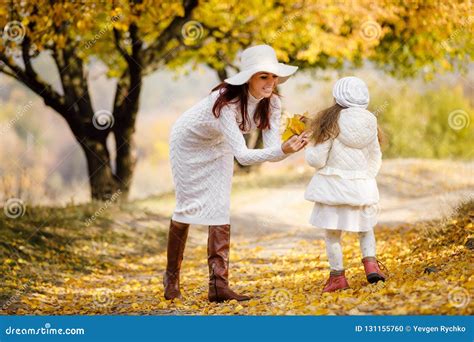 Charming Beautiful Mother Walks With Little Daughter Girl Stock Photo