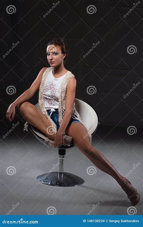 Charming Woman Posing Sitting On A Chair Stock Photo Image Of Charming Caucasian