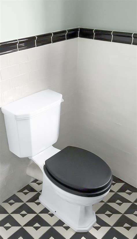 A Black Toilet Lid Is A Nice Additional Touch That Contributes To This
