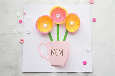 Make this adorable mother's day craft with your kids using popsicle sticks and buttons! Handmade Mothers Day Card - The Best Ideas for Kids