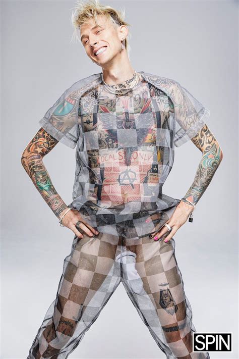 A Woman With Tattooed Arms And Legs Posing For A Magazine Cover Photo In Sheer Clothing