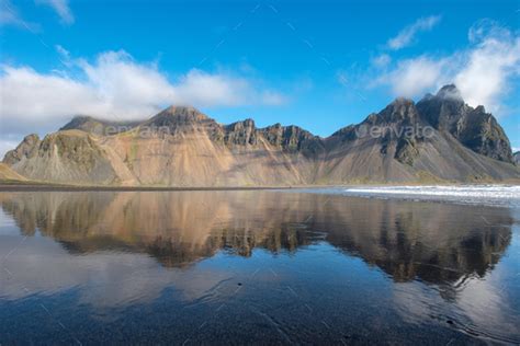Reflection Of Vestrahorn Mountain In The Waters Of The Atlantic Ocean