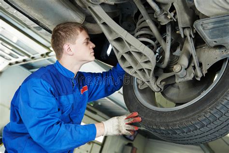 Auto Mechanic At Car Brake Shoes Eximining Stock Image Image Of