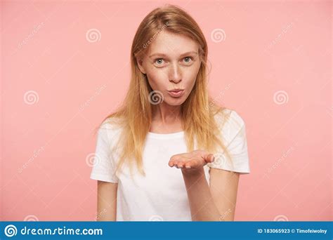 Positive Young Pretty Long Haired Redhead Lady Folding Her Lips While