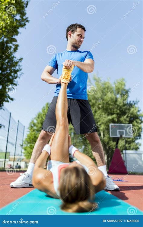 trainer helping to ease the strain stock image image of sportswoman ache 58855197