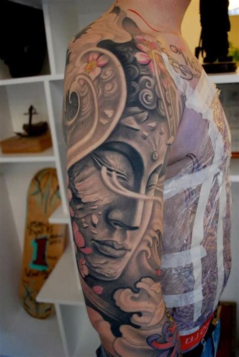 Multicolored Sleeve Tattoo Of Buddha Statue And Flowers Tattooimages Biz