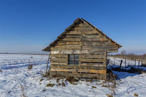 Landscape Of Old Abandoned Farm House Covered With Snow In A Frosty