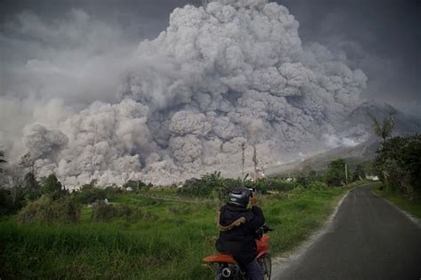 The eruption and dispersion of ash from indonesia's mount sinabung on monday, featuring a few thunderstorms at sunset. Mount Sinabung volcano eruption on Indonesia island of ...