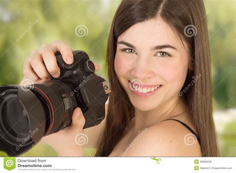 Closup Portrait Of Woman Photographer Taking A Photo With
