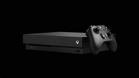 Download A Black Xbox One Console With A Controller Wallpaper