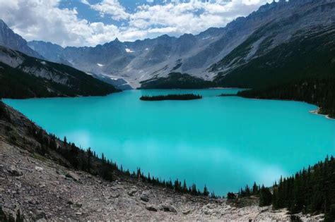 Premium Photo Bright Turquoise Mountain Lake Surrounded By Rocky