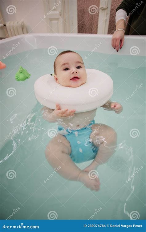 Baby Enjoying In The Jacuzzi Spa For Babies Hydrotherapy Session For